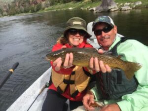 Couple displaying beautiful trophy Green River Trout