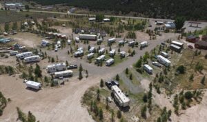 Dutch John Resort At Flaming Gorge  RV-Park Aerial View Showing Campground RV Sites Tent Sites And Luxury Cabins. 