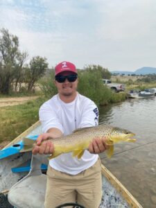 Huge Brown Trout is safely released back into the green river by Dutch John resort.