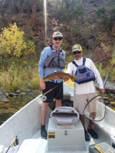 Huge Brown Trout is safely released back into the green river by Dutch John resort.