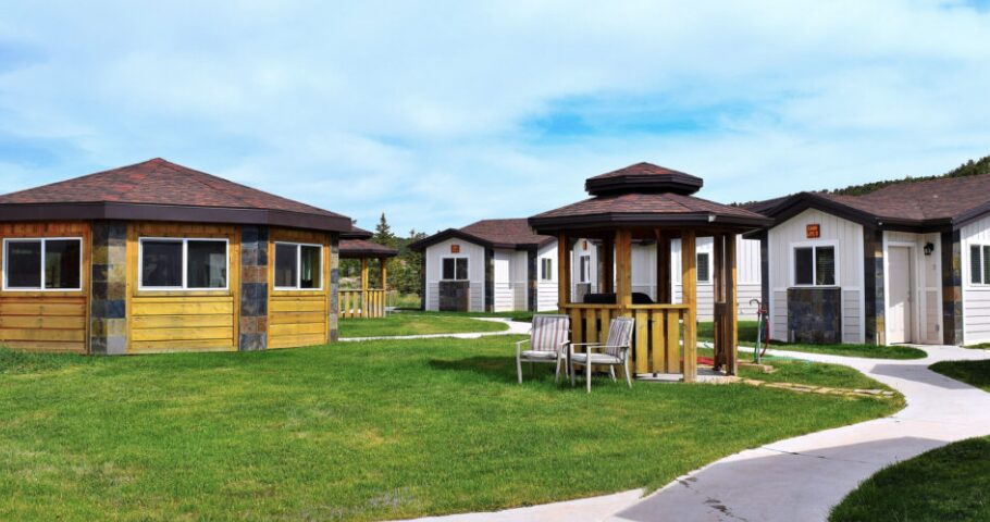 2 Fly Fishing Guests With Their Local Dutch John Green River Fishing Guide Netting A Trophy-size Size Brown Trout During A Full Day Of Fly Fishing On The Green River Tail Waters Below Flaming Gorge Dam Just 2 Miles From Dutch John Resort.