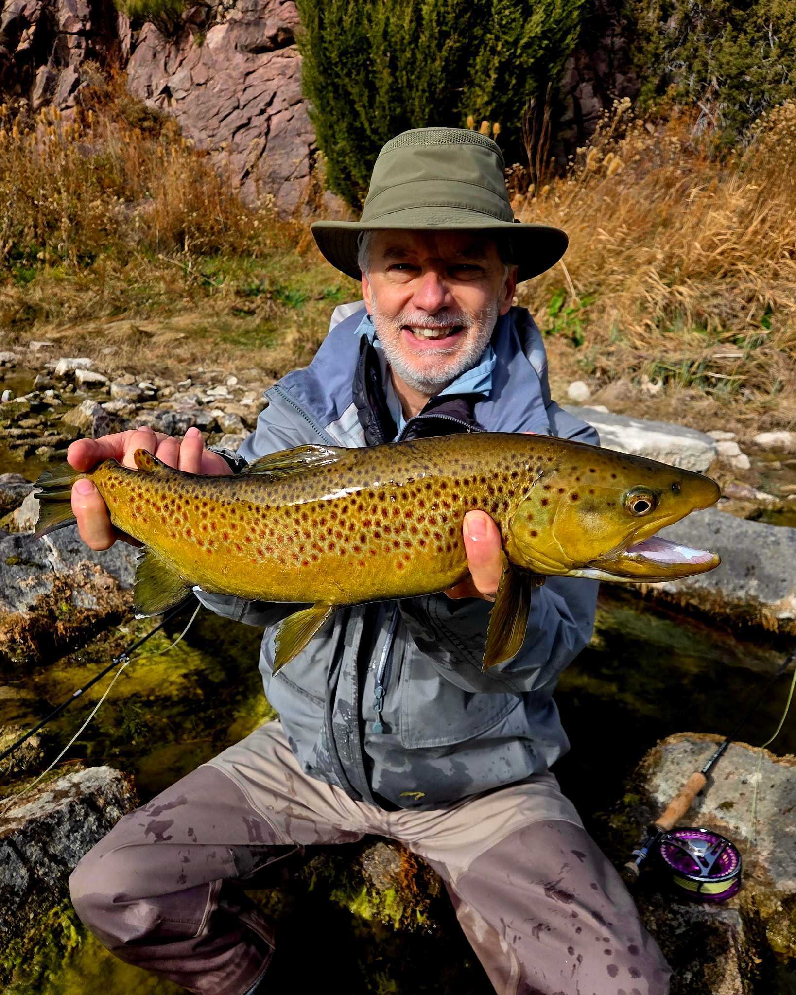 Green river fly fishing guides with trophy wild brown trout ready to br safely released back into the green river.