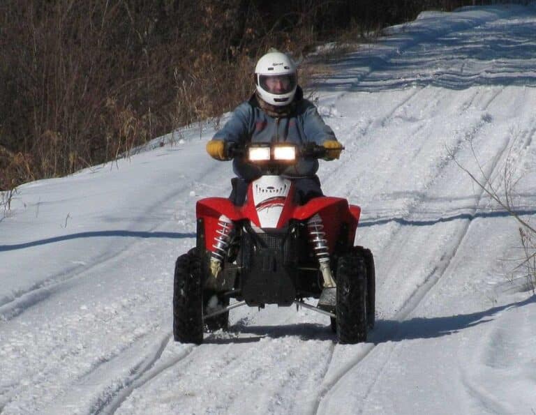 Winter ATV riding on snowy trails near Dutch John, Utah